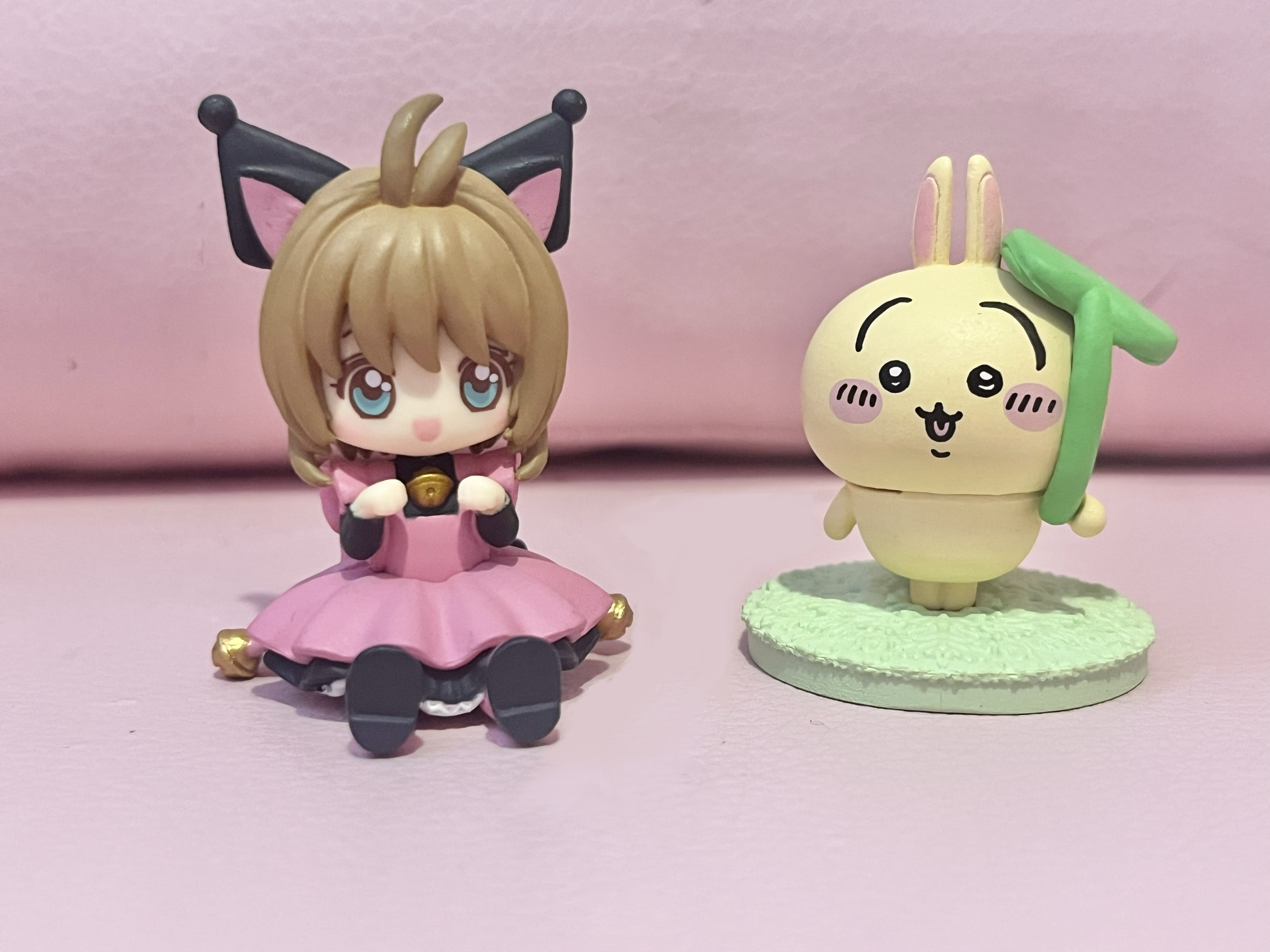 a kuromi cardcaptor sakura figure and a usagi from chiikawa figure