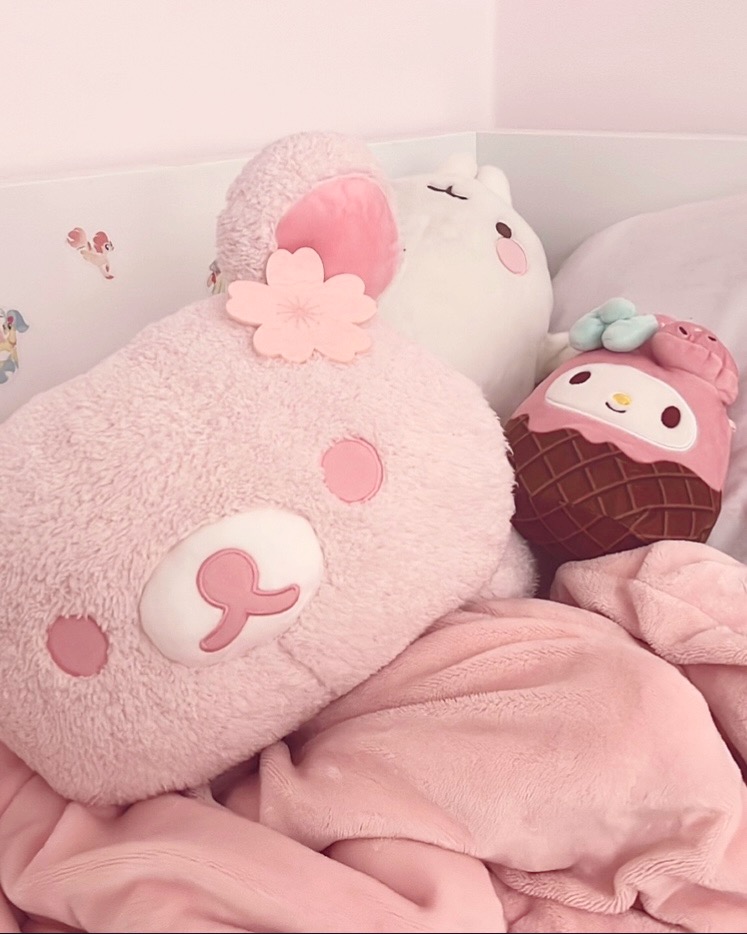 my bed with my plushies on it