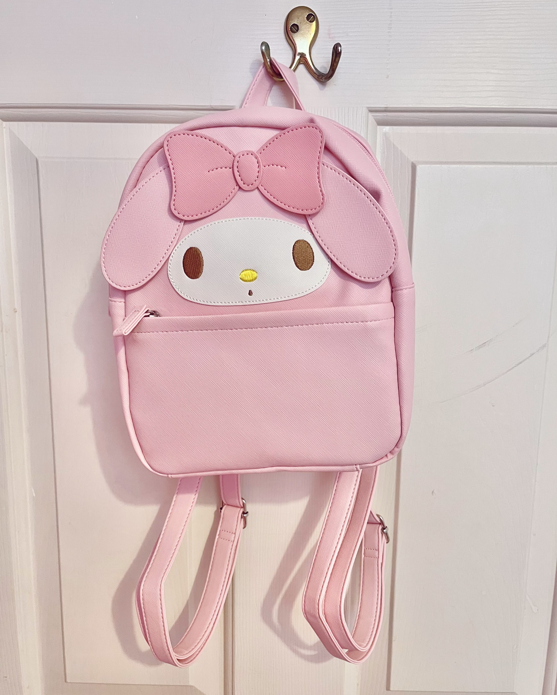 a my melody bag hug from a doorframe hook